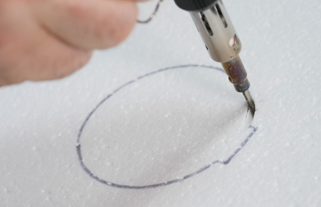 Precision cutting foam material using Iroda Pro professional portable butane soldering iron with hot knife tip.